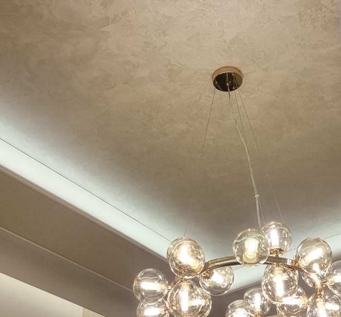 Applied by hand, each wall is a one-of-a-kind design, with options ranging from soft concrete textures to bold metallic and marble effects. 